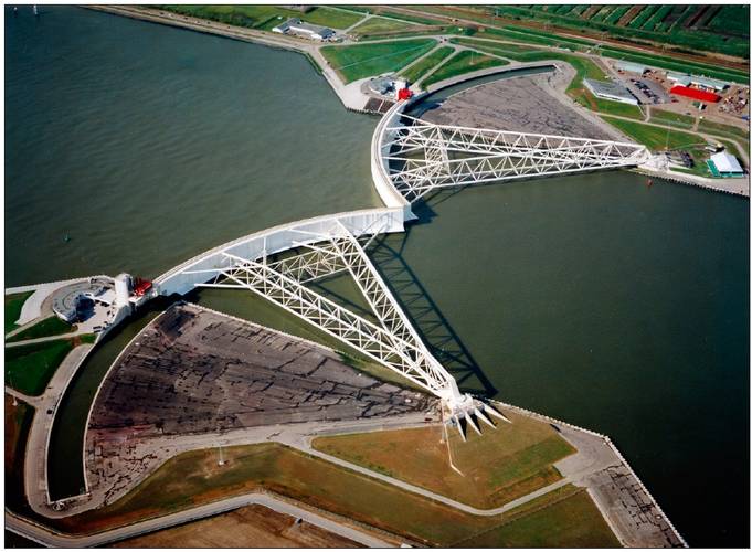 Figure 5. The Maeslant storm surge barrier near Rotterdam during a test closure (source: www.BeeldbankVenW.nl).