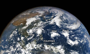 Beeld van de vier tyfoons op de wereldbol